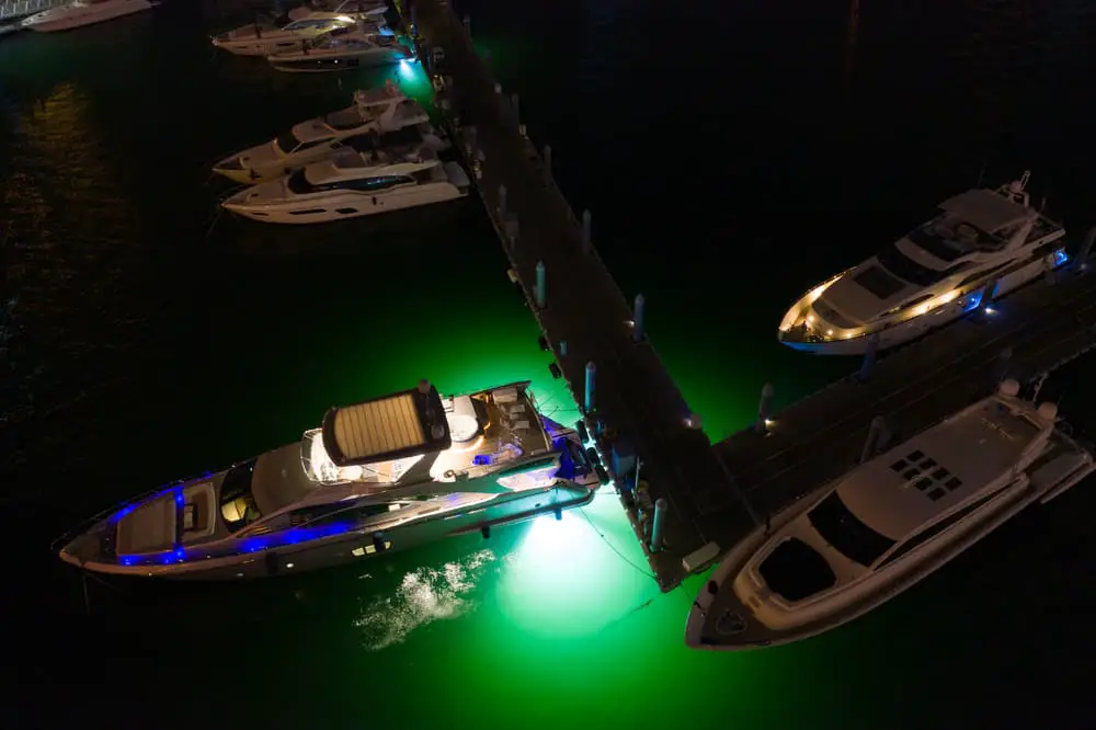Yachts with neon green underwater lighting Miami aerials