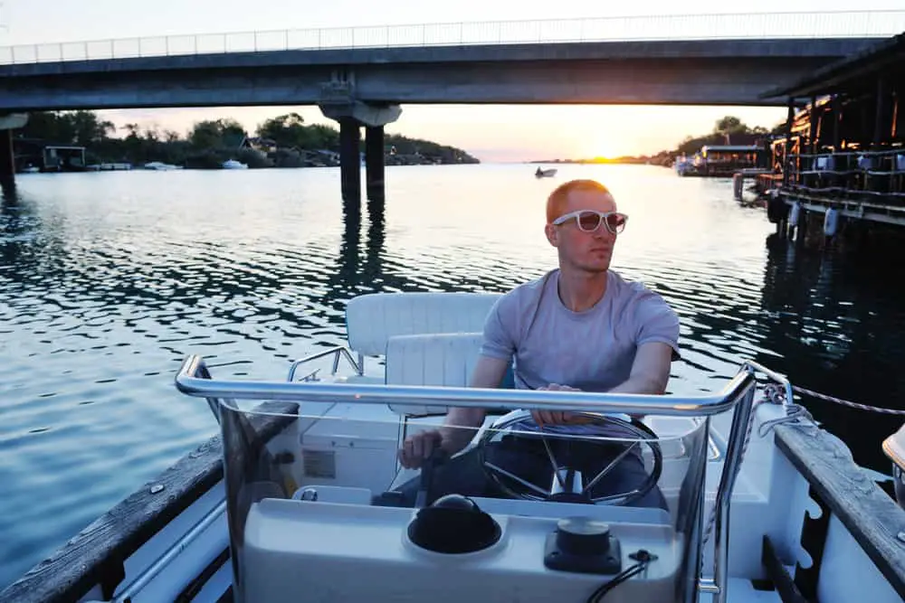 portrait of happy young man on boat